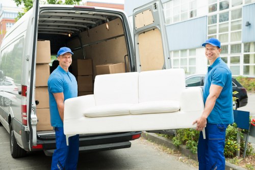 Removal team loading moving boxes for a Swiss Cottage house move