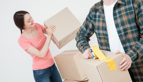 Loading furniture into a van for a Swiss Cottage home move