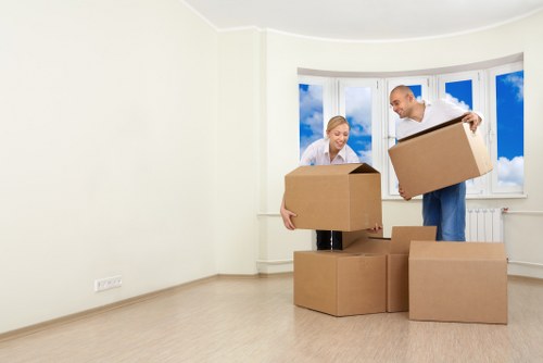 Professional movers handling office equipment near Swiss Cottage