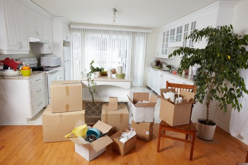 Professional removals team handling furniture for a Swiss Cottage house move