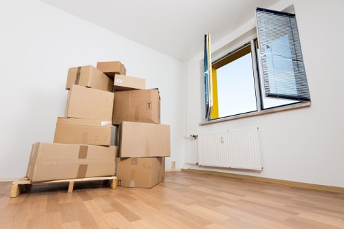 Assorted moving boxes and protective wrap for a Swiss Cottage relocation
