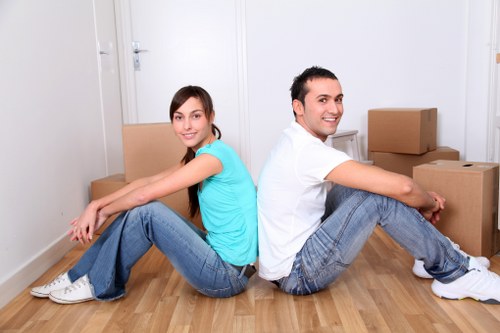 Packed office boxes and furniture ready for relocation in Swiss Cottage