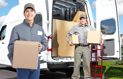 Professional movers securing belongings with safety-focused procedures