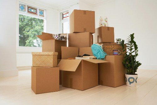 Professional movers loading furniture for a local relocation