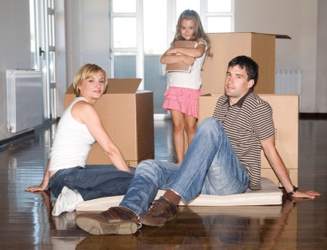 Packed moving boxes and furniture prepared for transport