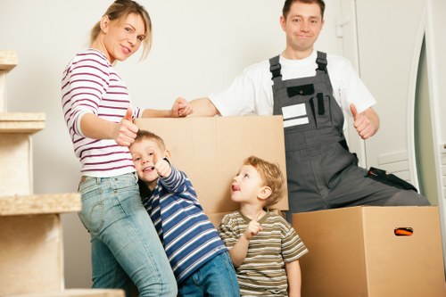 Crew using safe lifting methods during a removals job